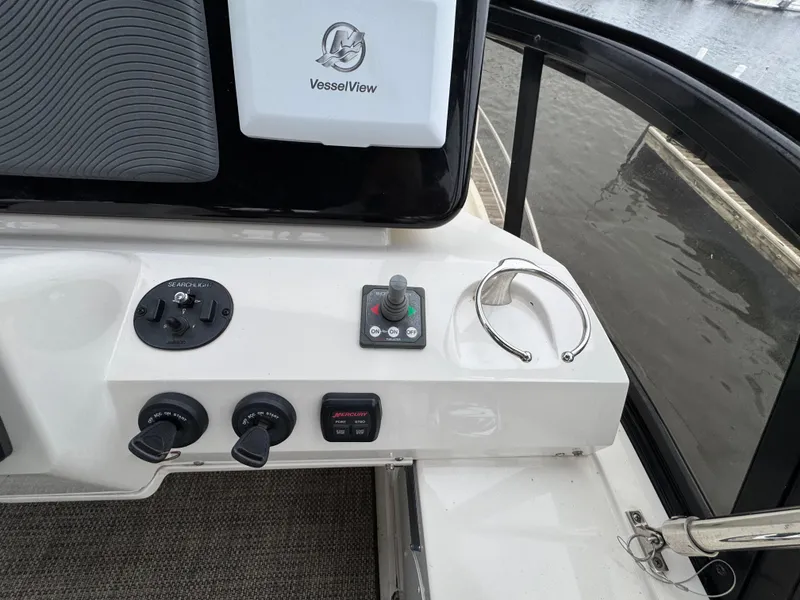 Slide: The Image of Control panel of 2014 Carver C40 Command Bridge with VesselView display and switches. - 18