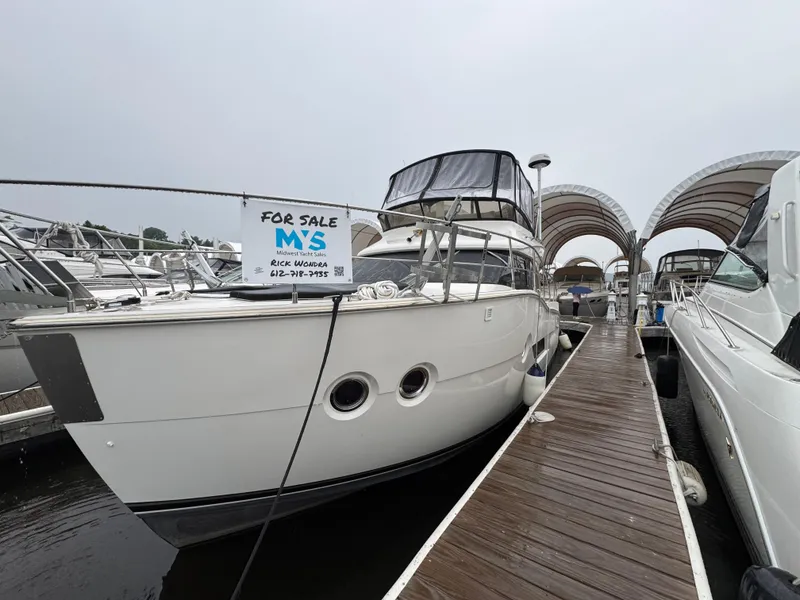 Slide: The Image of 2014 Carver C40 Command Bridge yacht for sale at marina dock. - 3