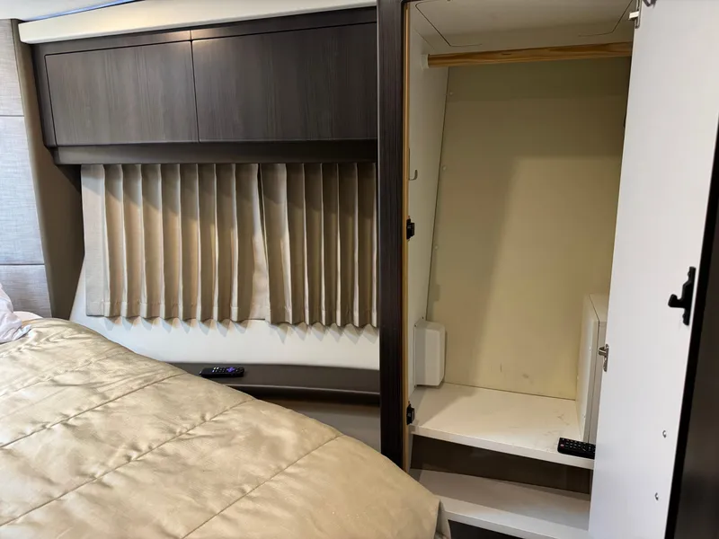 Slide: The Image of Interior of 2014 Carver C40 Command Bridge with bed, closet, and storage space. - 44