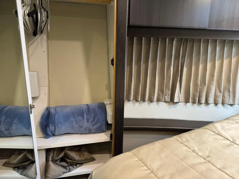 Slide: The Image of Interior of 2014 Carver C40 Command Bridge with closet and bed. - 46