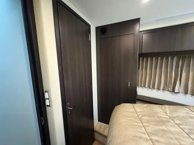 Slide: The Image of Interior cabin of 2014 Carver C40 Command Bridge with wood paneling and bed. - 47