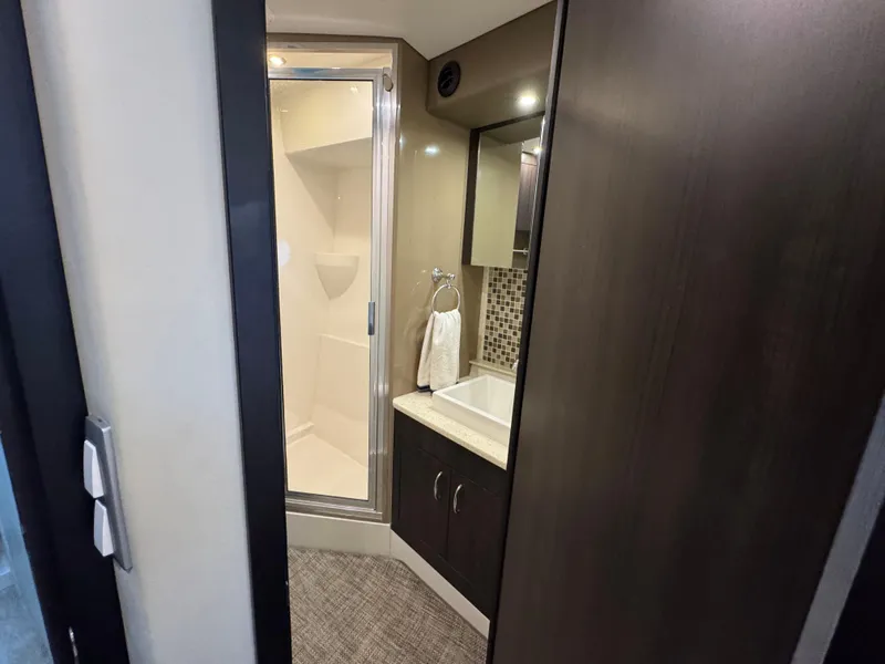 Slide: The Image of Bathroom interior of 2014 Carver C40 Command Bridge yacht, featuring shower and sink. - 48