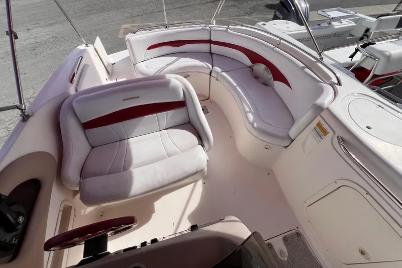 Slide: The Image of 2002 Chaparral 232 Sunesta boat interior with white and red seating. - 12