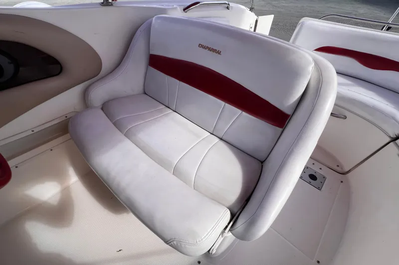 Slide: The Image of 2002 Chaparral 232 Sunesta boat seat with white and red upholstery. - 16