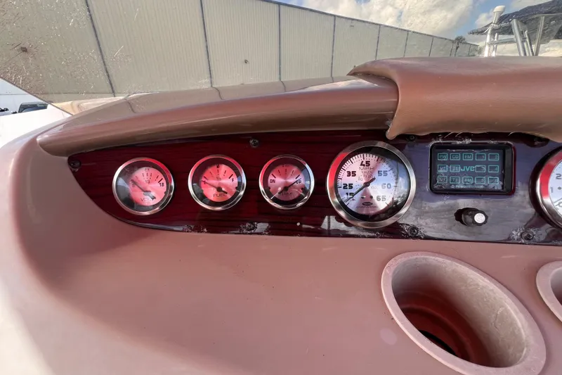 Slide: The Image of Dashboard of 2002 Chaparral 232 Sunesta boat with gauges and controls. - 23