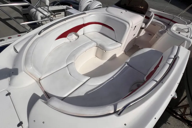 Slide: The Image of 2002 Chaparral 232 Sunesta boat interior with white and red seating arrangement. - 28