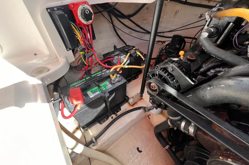 Slide: The Image of Engine compartment of a 2002 Chaparral 232 Sunesta with battery and wiring. - 36