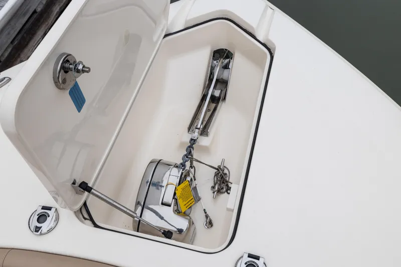 Slide: The Image of Anchor storage compartment on a 2021 Scout 277LXF boat. - 10