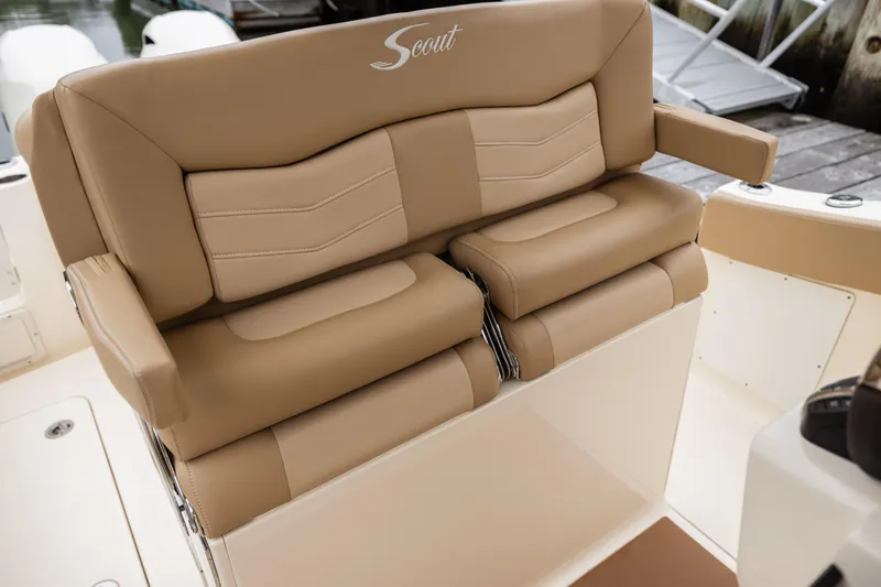Slide: The Image of 2021 Scout 277LXF boat with tan cushioned seating. - 12