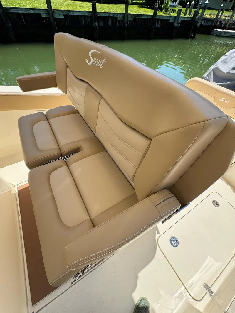 Slide: The Image of 2021 Scout 277LXF boat with tan leather seating. - 13