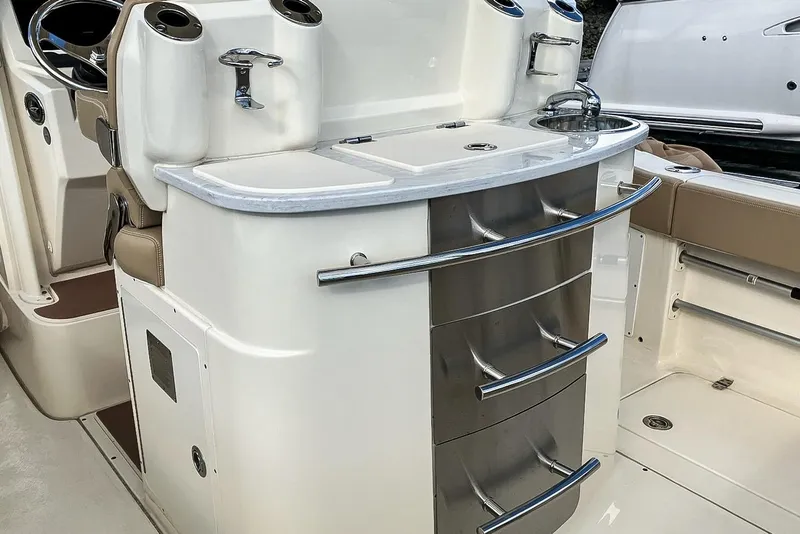 Slide: The Image of 2021 Scout 277 LXF boat interior with sleek storage and modern design. - 16