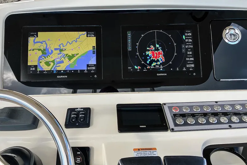 Slide: The Image of Control panel of 2021 Scout 277 LXF boat with Garmin navigation displays. - 5