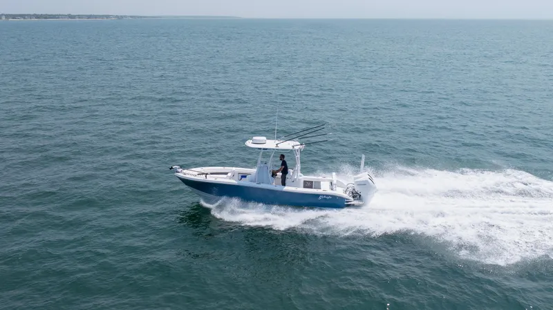 The Image of 2025 Yellowfin 26 Hybrid boat cruising on open water. - 0