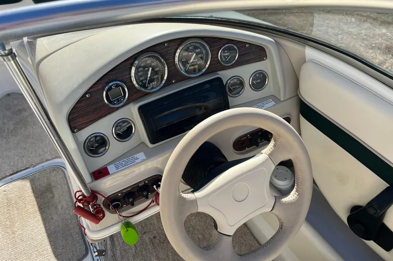 Slide: The Image of 1999 Chris-Craft 190 Bowrider dashboard with steering wheel and instrument panel. - 7