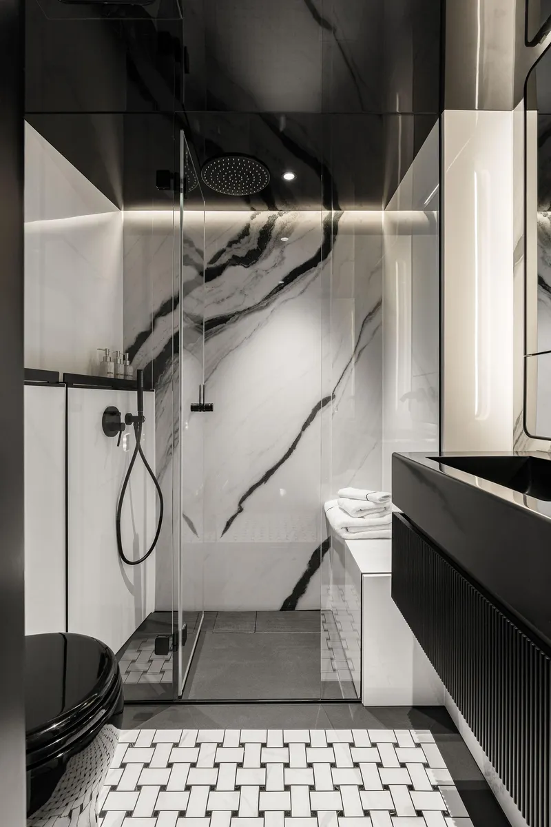 Slide: The Image of Luxurious bathroom in 2026 Sunreef 70 yacht with modern black and white design. - 11