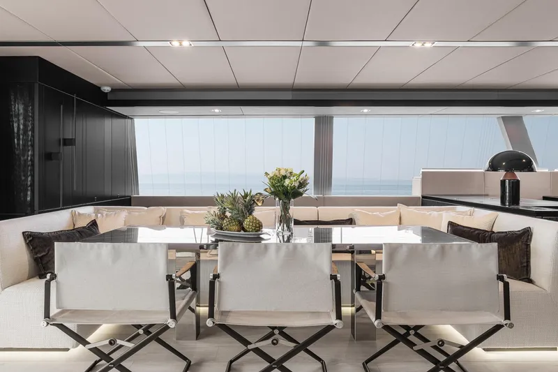 Slide: The Image of Luxurious interior of 2026 Sunreef 70 yacht with elegant dining area and ocean view. - 16