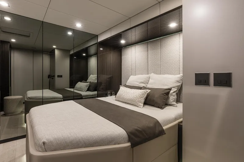 Slide: The Image of Luxurious bedroom interior of 2026 Sunreef 70 yacht with modern design and elegant bedding. - 18