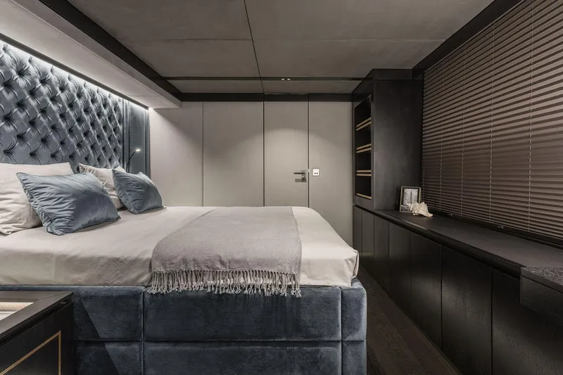 Slide: The Image of Luxurious bedroom interior on 2026 Sunreef 70 yacht with modern design and plush bedding. - 21