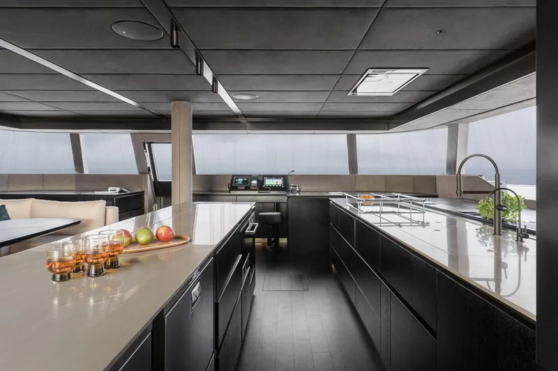 Slide: The Image of Luxurious interior of 2026 Sunreef 70 yacht with modern kitchen design and panoramic windows. - 6