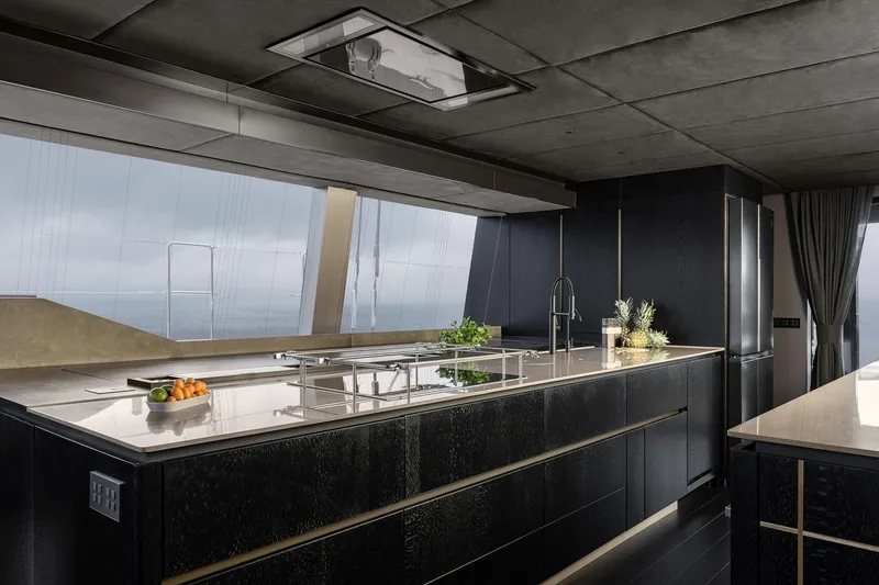 Slide: The Image of Luxurious kitchen interior of 2026 Sunreef 70 yacht with sleek black cabinetry and modern design. - 7