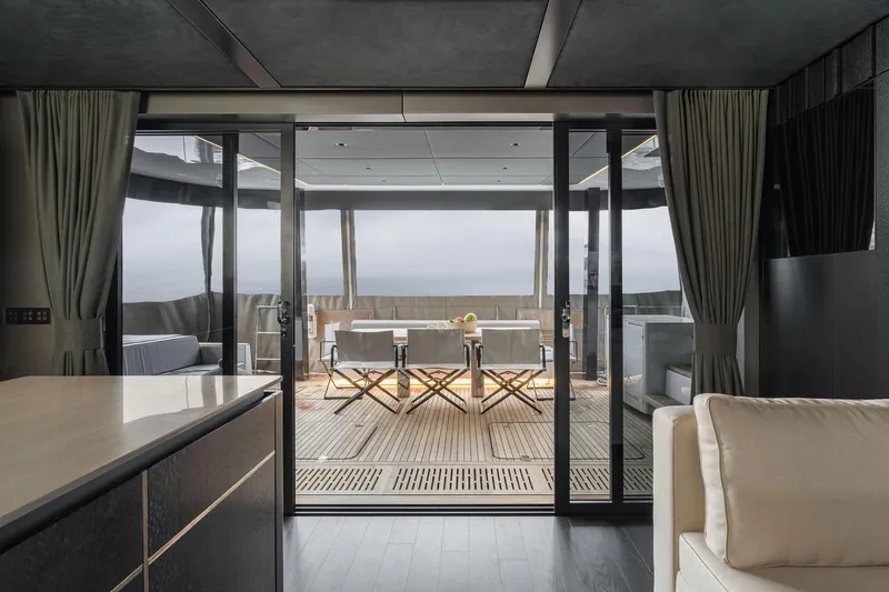 Slide: The Image of Luxurious interior of 2026 Sunreef 70 yacht with elegant outdoor seating area. - 8