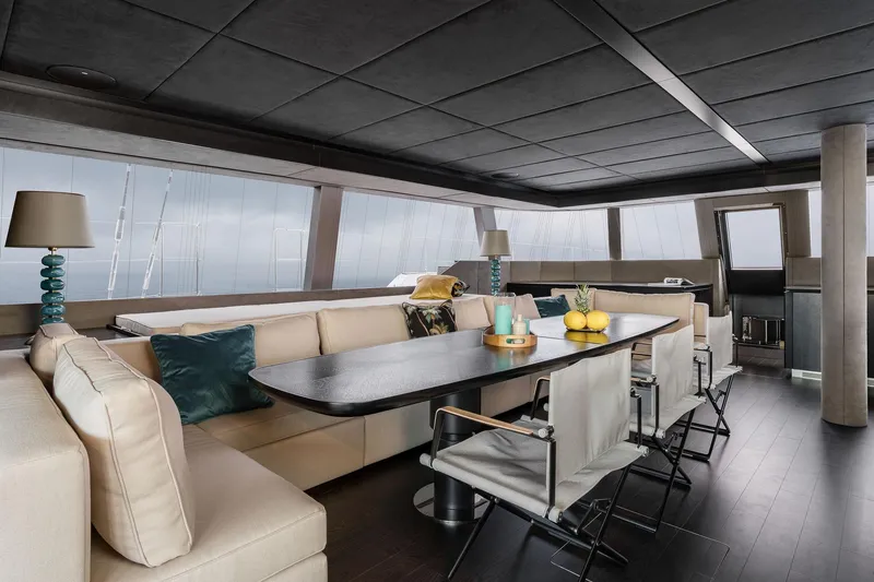 Slide: The Image of Luxurious interior of 2026 Sunreef 70 yacht with modern dining area and elegant furnishings. - 9