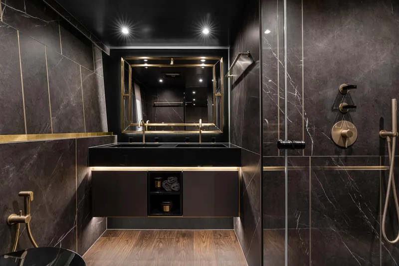 Slide: The Image of Luxurious bathroom interior on 2026 Sunreef 80 yacht, featuring elegant dark marble and modern fixtures. - 10