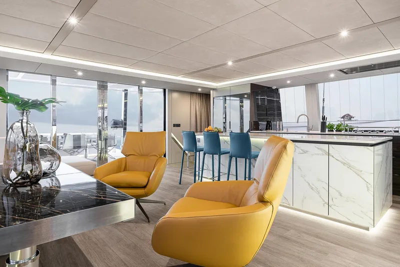 Slide: The Image of Luxurious interior of 2026 Sunreef 80 yacht with modern design and vibrant seating. - 11