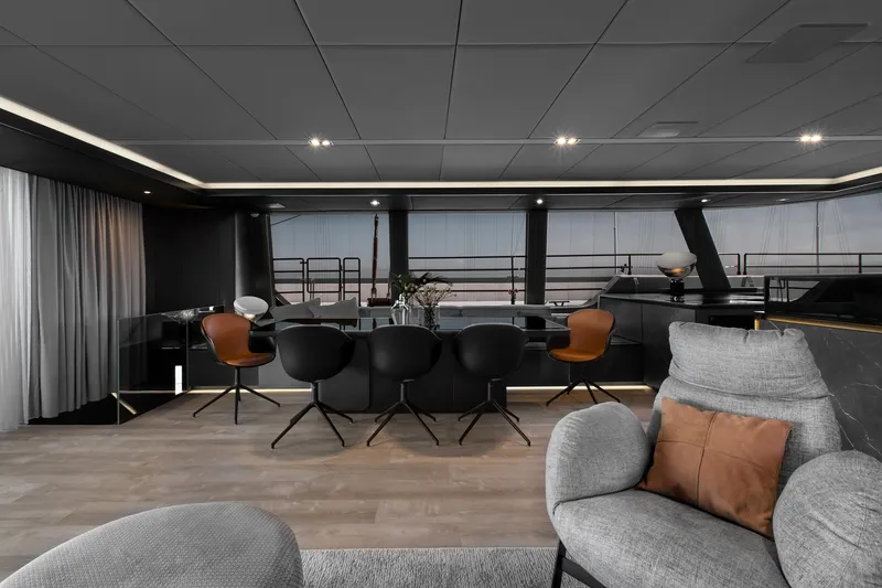 Slide: The Image of Luxurious interior of 2026 Sunreef 80 yacht with modern dining area and elegant seating. - 15
