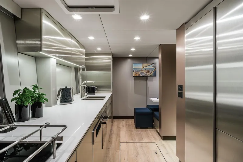 Slide: The Image of Luxurious modern kitchen interior on 2026 Sunreef 80 yacht, featuring sleek stainless steel design. - 23
