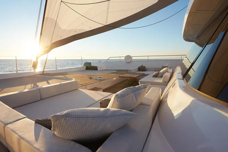 Slide: The Image of Luxurious Sunreef 80 yacht deck with elegant seating, sunset view, 2026 model. - 3