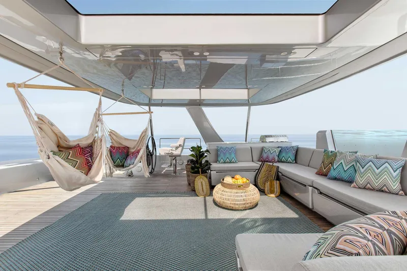 Slide: The Image of Luxurious Sunreef 80 yacht deck with hammocks, seating, and ocean view, 2026 model. - 4