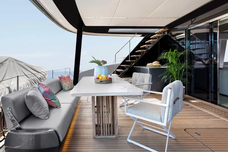 Slide: The Image of Luxurious Sunreef 80 yacht deck with modern seating and elegant dining area, 2026 model. - 5