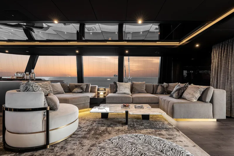 Slide: The Image of Luxurious Sunreef 80 yacht interior with elegant seating and sunset view, 2026 model. - 9