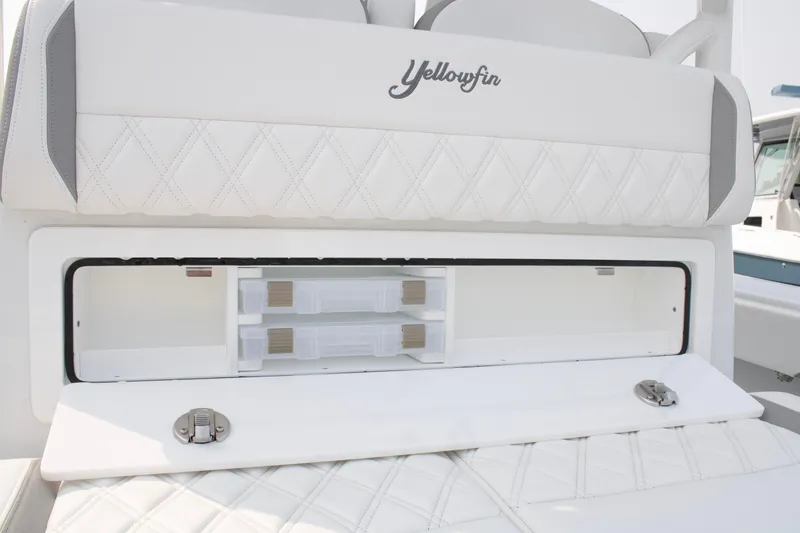 Slide: The Image of 2025 Yellowfin 32 Offshore boat with open storage compartment and quilted seating. - 20