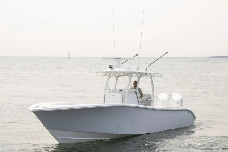 Slide: The Image of 2025 Yellowfin 32 Offshore boat cruising on open water. - 5