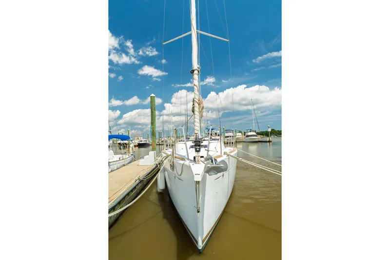 Slide: The Image of Interior view of 2018 Jeanneau Sun Odyssey 349 sailboat, featuring stairs and safety gear. - 12