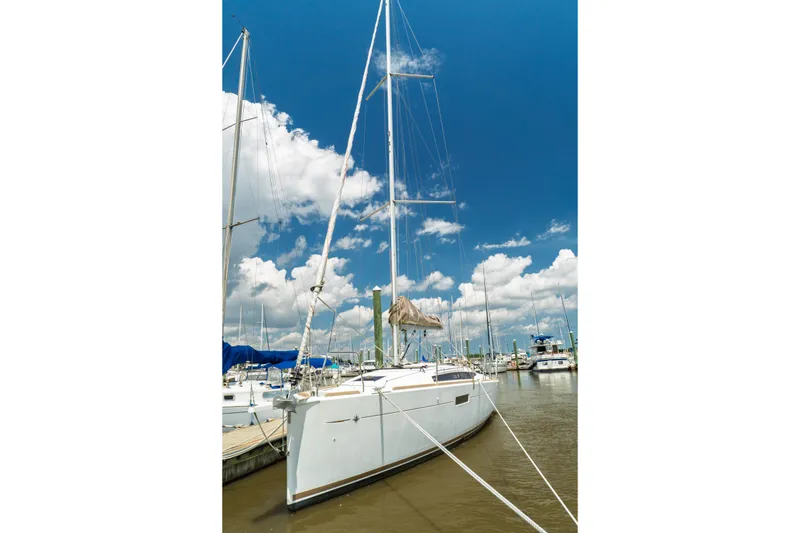 Slide: The Image of Interior of 2018 Jeanneau Sun Odyssey 349 sailboat with modern kitchen and seating area. - 14