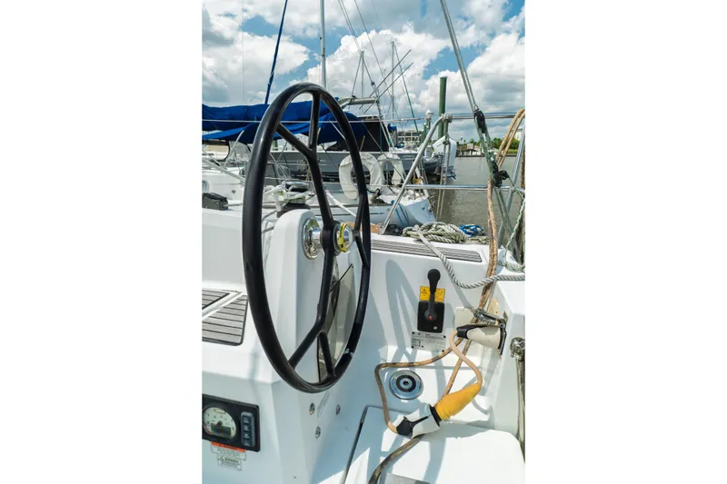 Slide: The Image of 2018 Jeanneau Sun Odyssey 349 interior cabin with compact kitchen and cozy sleeping area. - 21