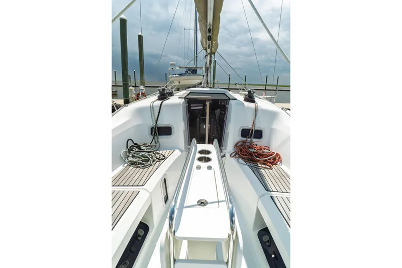 Slide: The Image of Interior of 2018 Jeanneau Sun Odyssey 349 sailboat, featuring modern kitchen and seating area. - 26