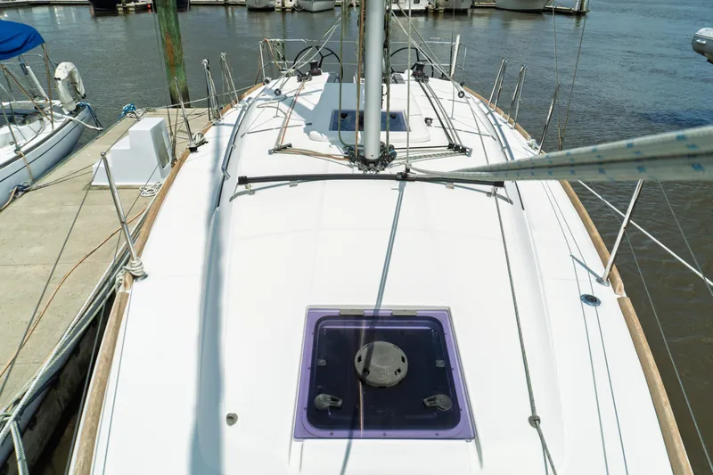 Slide: The Image of Interior of 2018 Jeanneau Sun Odyssey 349 sailboat, featuring seating and navigation area. - 31