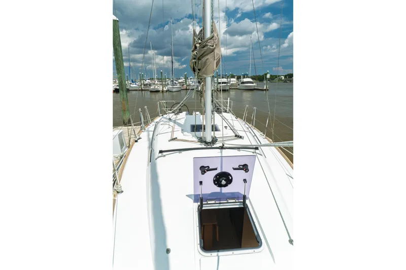 Slide: The Image of Interior of 2018 Jeanneau Sun Odyssey 349 sailboat, featuring modern kitchen and seating area. - 32