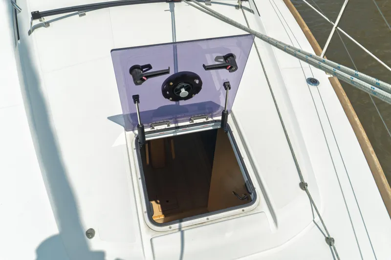 Slide: The Image of Interior of 2018 Jeanneau Sun Odyssey 349 sailboat, featuring kitchen, navigation station, and bathroom. - 33