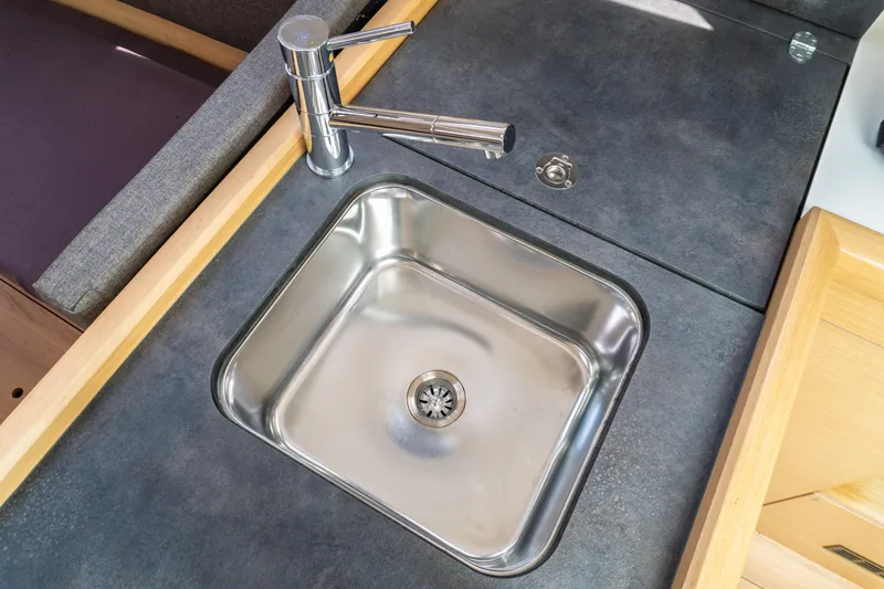 Slide: The Image of Interior of 2018 Jeanneau Sun Odyssey 349 sailboat, featuring modern seating and wooden finishes. - 40