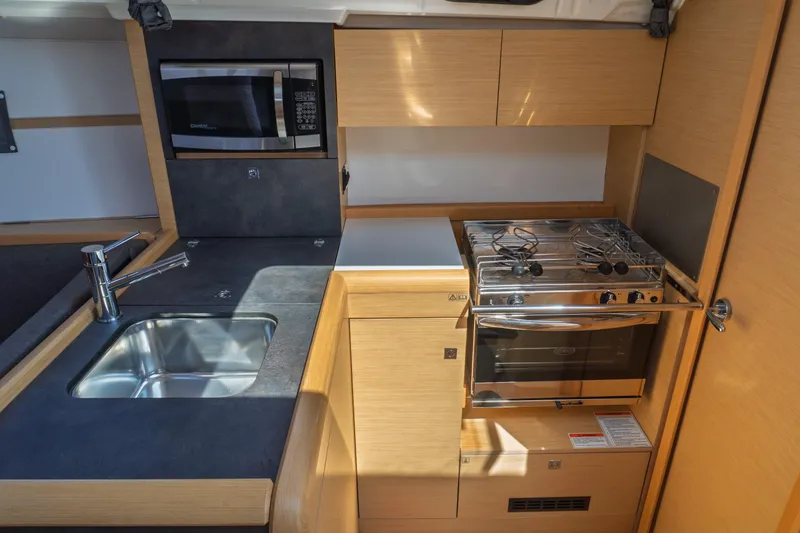 Slide: The Image of Cozy cabin interior of 2018 Jeanneau Sun Odyssey 349 sailboat with skylight. - 41