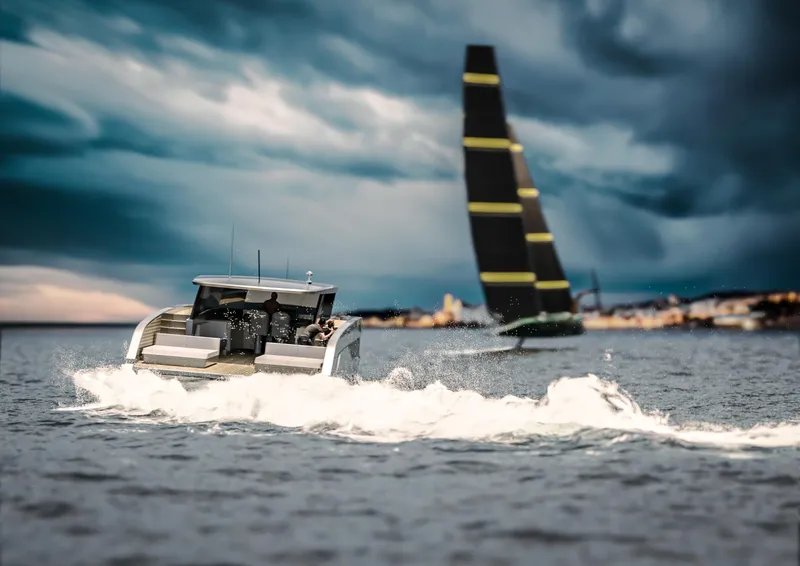 Slide: The Image of 2026 Sunreef 44 Ultima yacht cruising on a stormy sea with a sailboat in the background. - 10