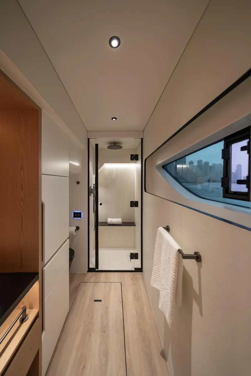 Slide: The Image of Luxurious bathroom interior of 2026 Sunreef 55 Ultima yacht with modern design and window view. - 10