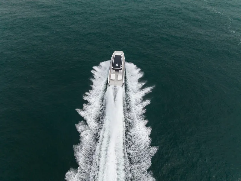 Slide: The Image of Aerial view of 2026 Sunreef 55 Ultima yacht cruising on open water. - 15
