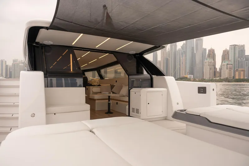 Slide: The Image of 2026 Sunreef 55 Ultima yacht with luxurious interior and city skyline backdrop. - 6