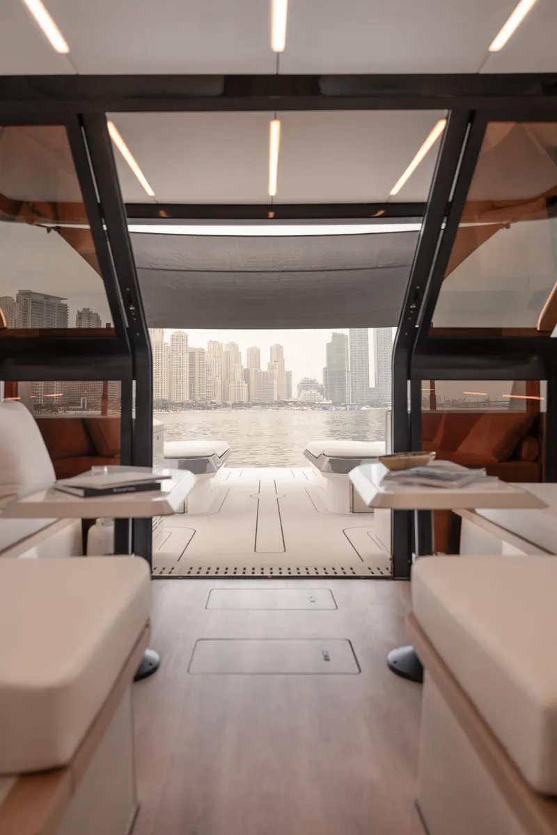 Slide: The Image of Interior view of 2026 Sunreef 55 Ultima yacht with city skyline in background. - 8